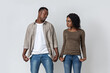 © Prostock-studio - Black Man And Woman With Empty Pockets Over Grey