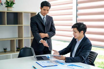 Wall Mural - Young asian businessman working together in the office.