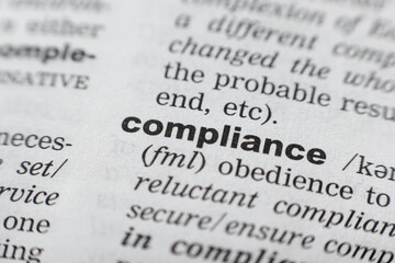 Dictionary definition of the word COMPLIANCE. Close-up shot