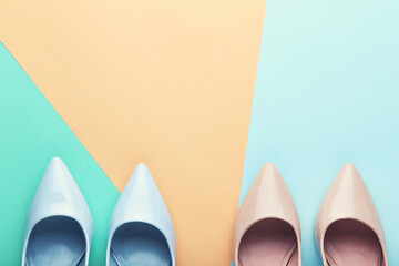 Wall Mural - Different high heel shoes on colorful background