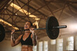 © Jacob Lund - Bodybuilder woman doing weight lifting workout