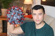© ajr_images - Young ethnic man close to virus