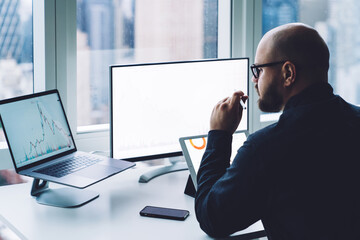 Businessman working on laptop in office