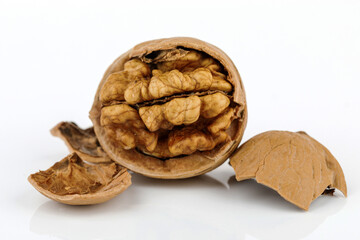 some cracked walnuts isolated on white background