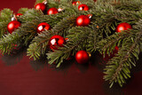 Fototapeta Londyn - Christmas festive background with coniferous branches and Christmas balls