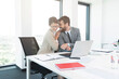 © focusandblur - Businessman romancing with pretty secretary at office