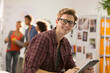 © Tom Merton/Caia Image - Portrait confident creative young businessman using digital tablet in office