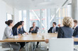 © Martin Barraud/Caia Image - Corporate business people talking in conference room meeting
