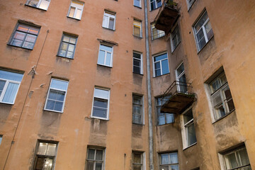 Poster - residential stone old house in the city in the evening