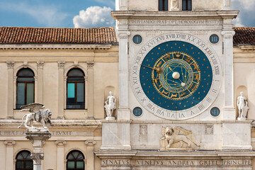 Wall Mural - Padua, medieval Clock Tower (XIV century) and marble statue of the winged Lion of Saint Mark, Piazza dei Signori, Veneto, Italy, Europe.