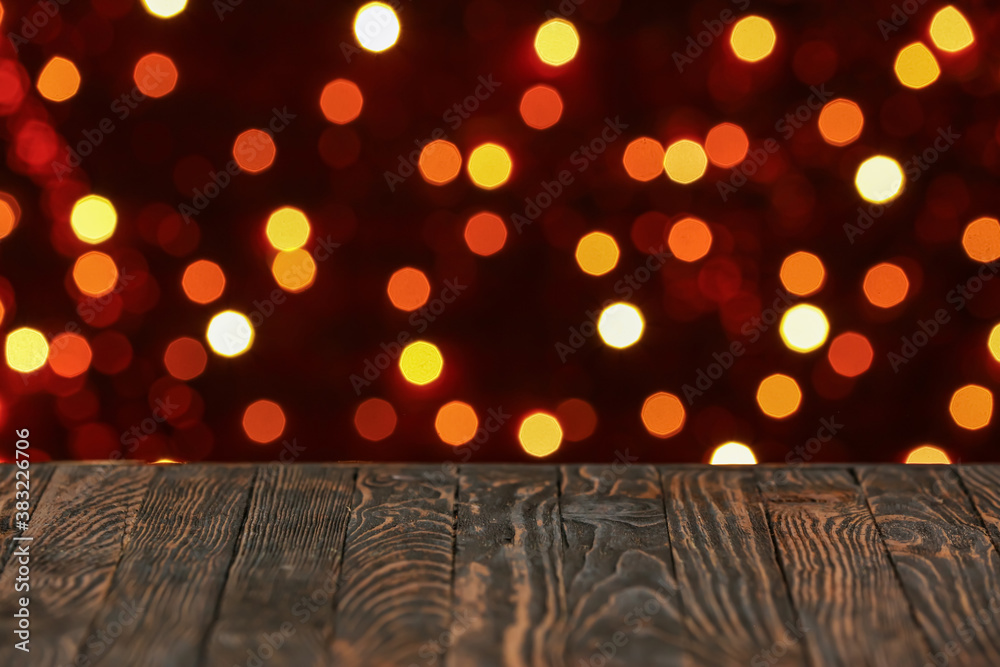 View of table against blurred Christmas lights