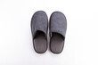 Pair of blank soft gray home slippers, design mockup. Hotel bath slippers top view isolated on white background. Clear warm domestic sandal or sneakers. Bed shoes accessory footwear.