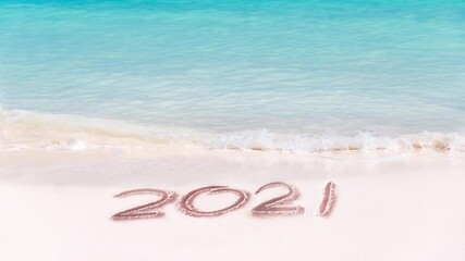 Wall Mural - 2021 written on the sand of a tropical beach. Video HD, seamless loop