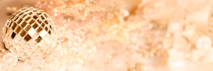 Wall Mural - Golden shiny Christmas ornaments on panoramic background, holiday web banner