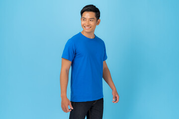 Young man in blue t-shirt isolated on blue background