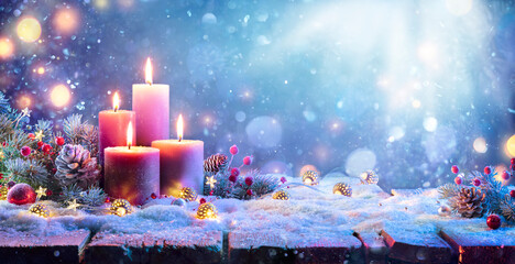 Wall Mural - advent - four purple candles with christmas ornament in shiny night
