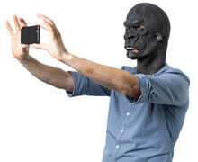 Man In Gorilla Mask Taking Selfie With Phone Isolated Cutout