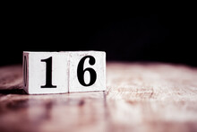 Number 16 Isolated On Dark Background- 3D Number Sixteen Isolated On Vintage Wooden Table