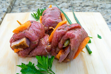 beef roll with carrot and bacon, called brachola or braciola. ready for cooking