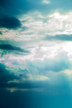 Blue Dramatic Sky With Volume Clouds And Sun Rays Vertical Orientation