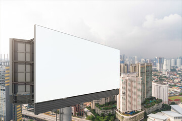 Blank white road billboard with KL cityscape background at day time. Street advertising poster, mock up, 3D rendering. Side view. The concept of marketing communication to promote or sell idea.