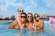 © New Africa - Happy family in outdoor swimming pool on sunny summer day