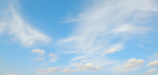 Wall Mural - White clouds on blue sky.