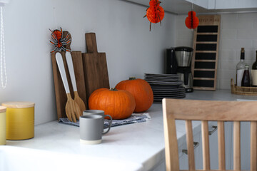 Poster - Fresh ripe pumpkins on countertop in kitchen decorated for Halloween