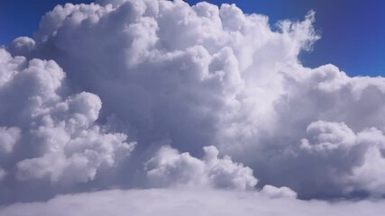 Wall Mural - White clouds in blue sky. Aerial bird's eye clouds. Aerial top cloudscape. Texture of clouds. View from above.