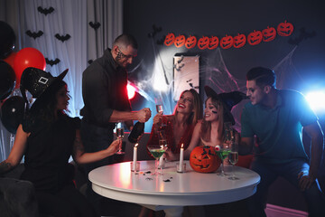 Poster - Group of friends having Halloween party at home