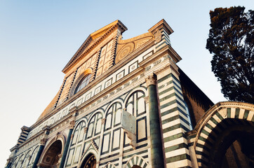 Wall Mural - front view of the famous basilica of Santa Maria Novella, in florence (Italy) with its white and green marble facade