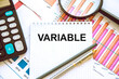 © Valiantsina - the variable text is written on notepad. variable graphics. finance variable