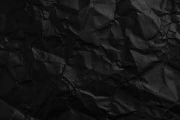 Wall Mural - Crushed black paper abstract background