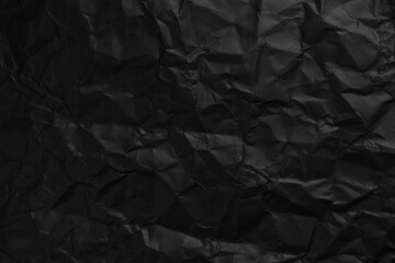 Wall Mural - Black background texture of crumpled paper