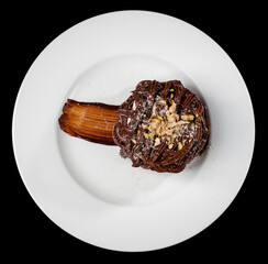 Kiev cake with nuts and chocolate. Close-up photography in a restaurant. Sweet delicious dessert of Russian cuisine.