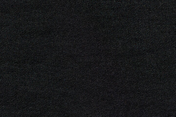Abstract black synthetic fabric texture and background. Detail of canvas textile material.