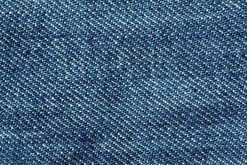 Abstract blue jeans fabric texture and background. Detail of jean textile material.