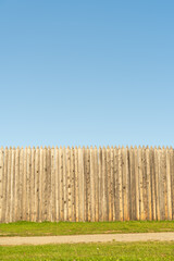 Wooden fence against the blue sky.