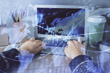 Double exposure of woman hands typing on computer and forex chart hologram drawing. Stock market invest concept.