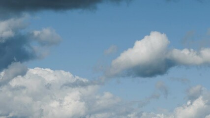 Wall Mural - Blue sky white clouds. Puffy fluffy white clouds timelapse. Summer blue sky time lapse.