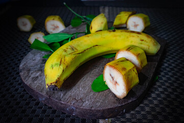 Wall Mural - Banana and organic banana over  wooden plank.