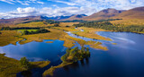Fototapeta Łazienka - aerial drone image of loch tulla in the argyll region of the highlands of scotland during autumn on a clear bright day showing calm waters on the inland loch