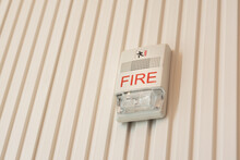 Fire Alarm With Built In Strobe Light Installed At The Wall