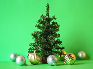 Christmas tree and decorations on a green background