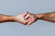 Male hand united in handshake. Man help hands, guardianship, protection. Two hands, isolated arm, helping hand of a friend. Friendly handshake, friends greeting