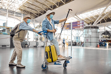 Woman enjoying her ride on a baggage cart