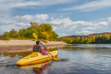 Kayak Fun Water Sports Down On River In Laurentians, Quebec. Canada Travel Destination. Woman Kayaker Kayaking In Mont-Tremblant During Autumn.