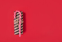 A Stripped Gift Box On Red Background, Zero Waste Christmas Concept, Space For Text, Top View