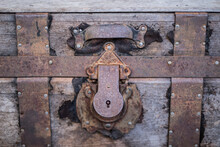 Old Rusty Padlock On A Wooden Door