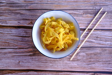 Poster - noodle soup with pork on wood table background